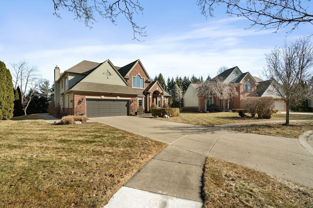 view of front of home with driveway, a front yard, a garage, brick siding, and a chimney