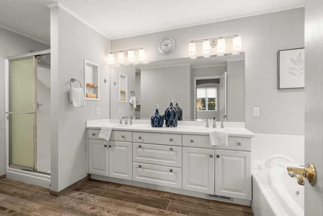 bathroom featuring a sink, ornamental molding, visible vents, and wood finish floors