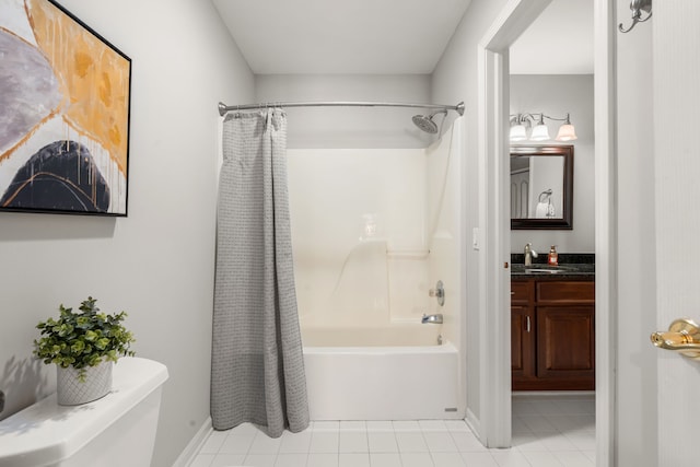 bathroom featuring vanity, baseboards, shower / tub combo, tile patterned floors, and toilet