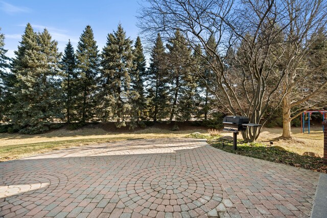 view of street with decorative driveway