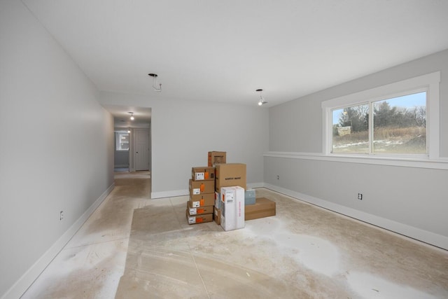 interior space featuring baseboards