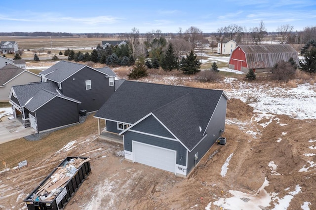 snowy aerial view featuring a residential view