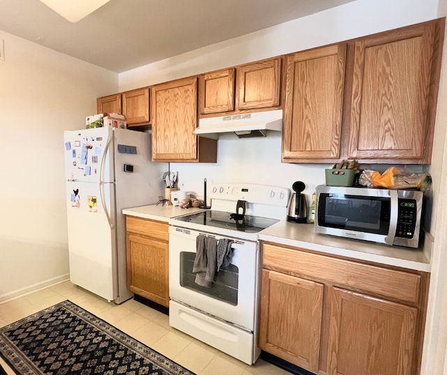 kitchen with under cabinet range hood, white appliances, baseboards, light countertops, and brown cabinets