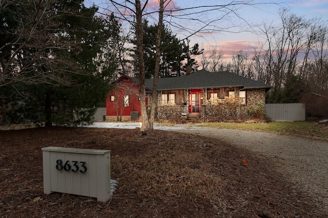 view of front of home with a porch and fence