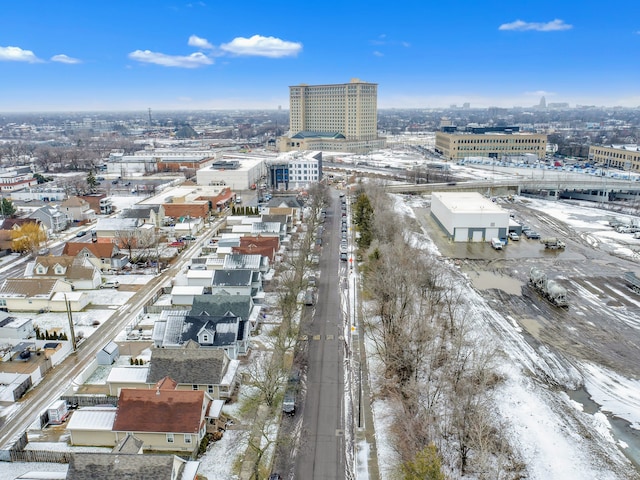 snowy aerial view featuring a city view