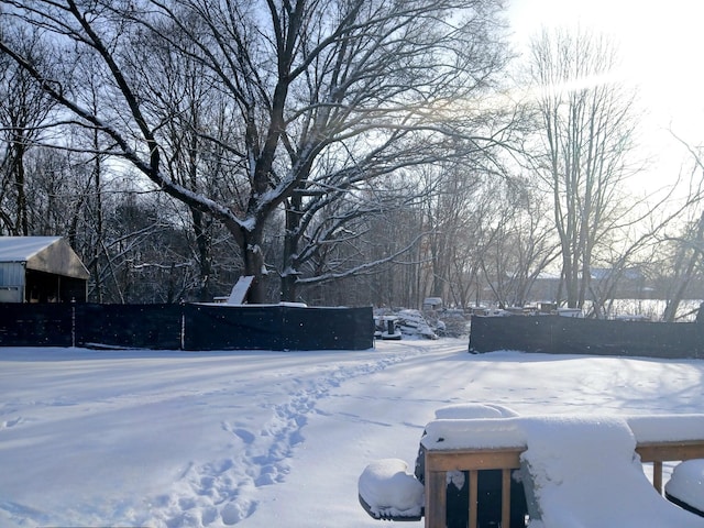 view of yard layered in snow