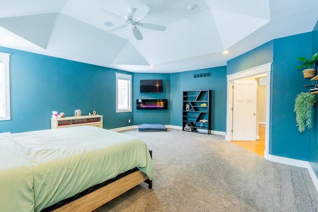 carpeted bedroom with ceiling fan, recessed lighting, visible vents, baseboards, and vaulted ceiling