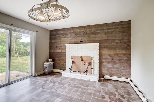 interior space featuring a baseboard radiator and wooden walls