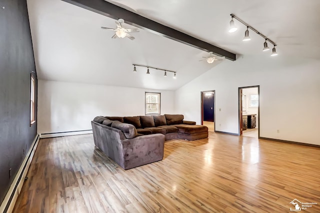 living room with a baseboard heating unit, light wood-style floors, a baseboard radiator, and vaulted ceiling with beams