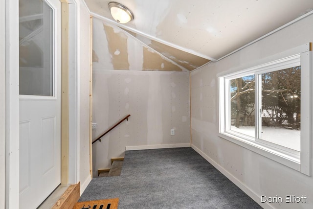 basement featuring carpet floors and baseboards