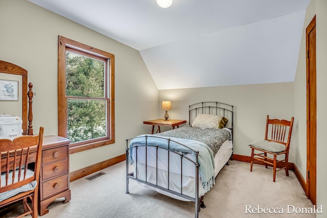 bedroom featuring multiple windows, visible vents, and light colored carpet