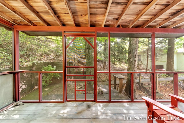 unfurnished sunroom featuring wood ceiling