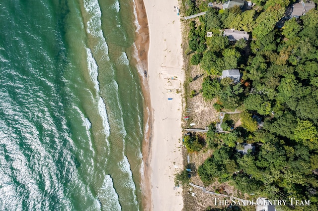 birds eye view of property featuring a water view and a view of the beach