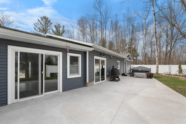 9356 Miramichi Dr, Evart, MI 49631 - exterior space with fence and a jacuzzi