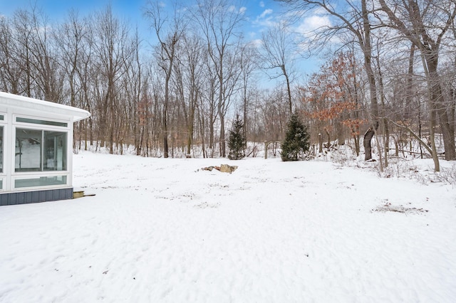 view of yard layered in snow