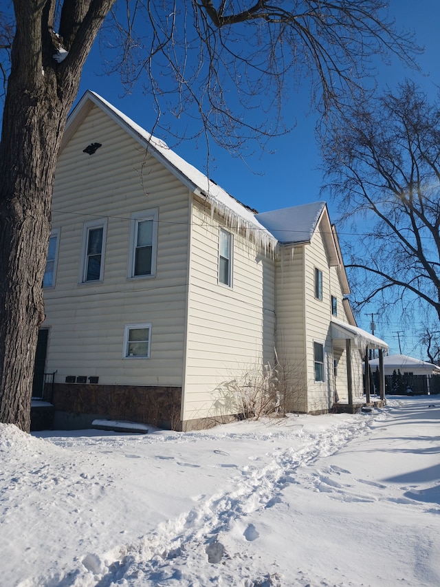 view of snow covered property