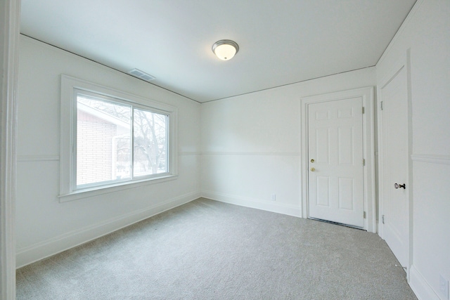 9543 W Outer Dr, Detroit, MI 48223 - spare room featuring baseboards, visible vents, and carpet floors