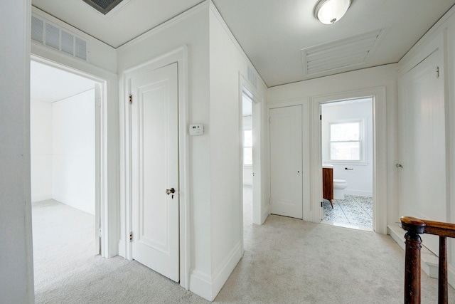 9543 W Outer Dr, Detroit, MI 48223 - hallway featuring light colored carpet, baseboards, and visible vents