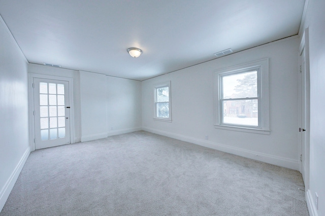 9543 W Outer Dr, Detroit, MI 48223 - spare room with light carpet, baseboards, and visible vents