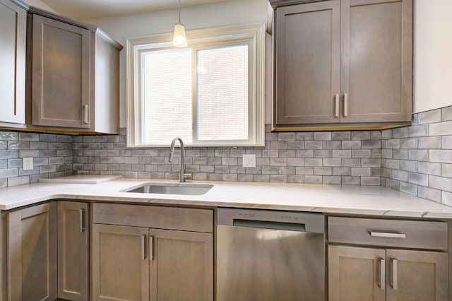 9543 W Outer Dr, Detroit, MI 48223 - kitchen featuring decorative backsplash, stainless steel dishwasher, decorative light fixtures, and a sink