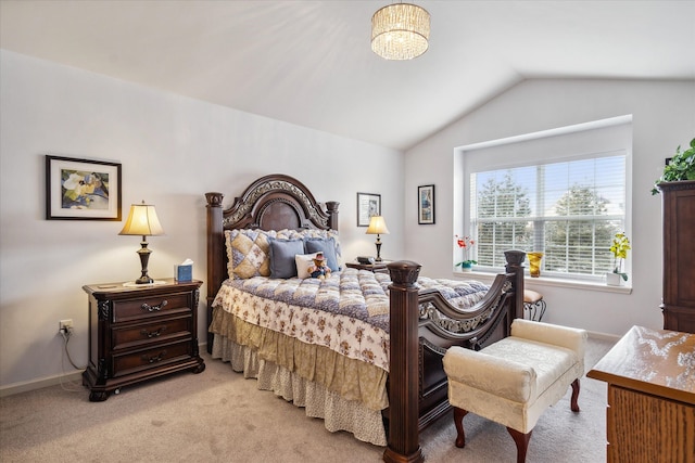 bedroom featuring light carpet, baseboards, and vaulted ceiling