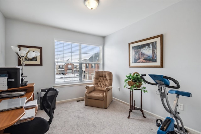 office featuring light colored carpet, visible vents, and baseboards