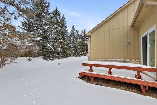 view of yard layered in snow