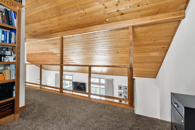 unfurnished living room featuring vaulted ceiling with beams, carpet, and wood ceiling