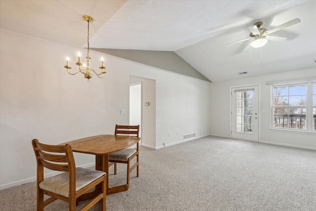 dining space with baseboards, visible vents, vaulted ceiling, and carpet flooring