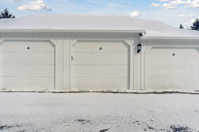 view of snow covered garage