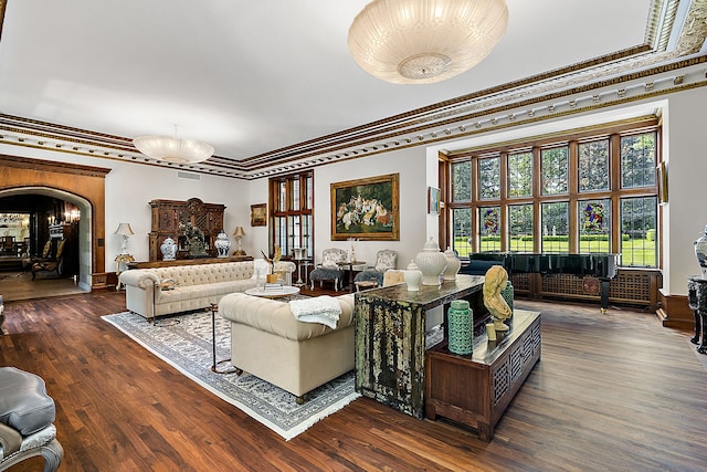 1771 Balmoral Dr, Detroit, MI 48203 - living area featuring wood finished floors, visible vents, arched walkways, and ornamental molding