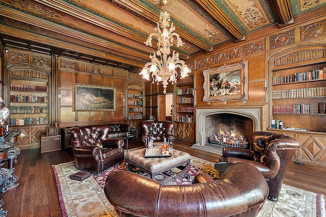 1771 Balmoral Dr, Detroit, MI 48203 - living room with built in features, wood finished floors, an inviting chandelier, and a premium fireplace