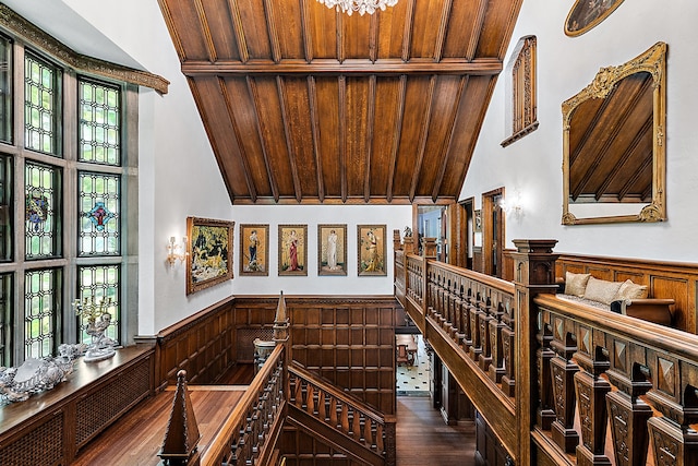 1771 Balmoral Dr, Detroit, MI 48203 - wine room featuring dark wood-type flooring, wood walls, wooden ceiling, wainscoting, and vaulted ceiling