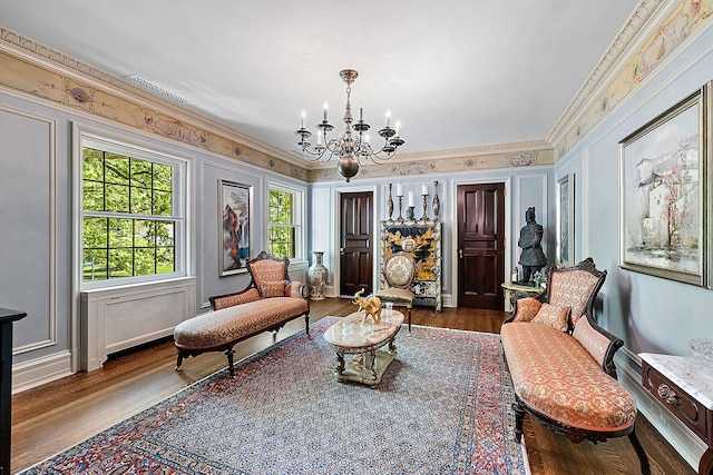 1771 Balmoral Dr, Detroit, MI 48203 - living area featuring crown molding, wood finished floors, visible vents, and a chandelier
