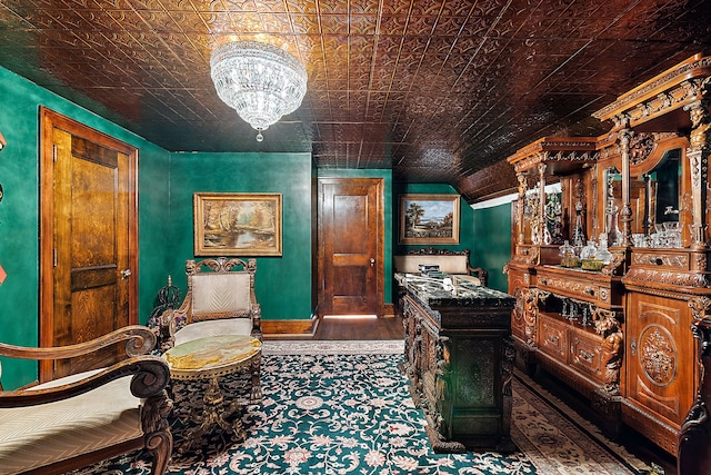 1771 Balmoral Dr, Detroit, MI 48203 - home office with baseboards, lofted ceiling, an inviting chandelier, wood finished floors, and an ornate ceiling