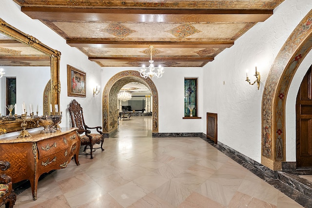 1771 Balmoral Dr, Detroit, MI 48203 - hallway featuring baseboards, an inviting chandelier, beam ceiling, arched walkways, and a textured wall