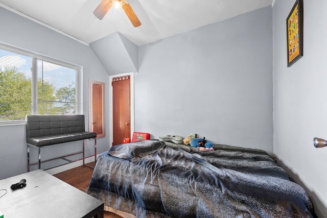 bedroom featuring a ceiling fan and wood finished floors