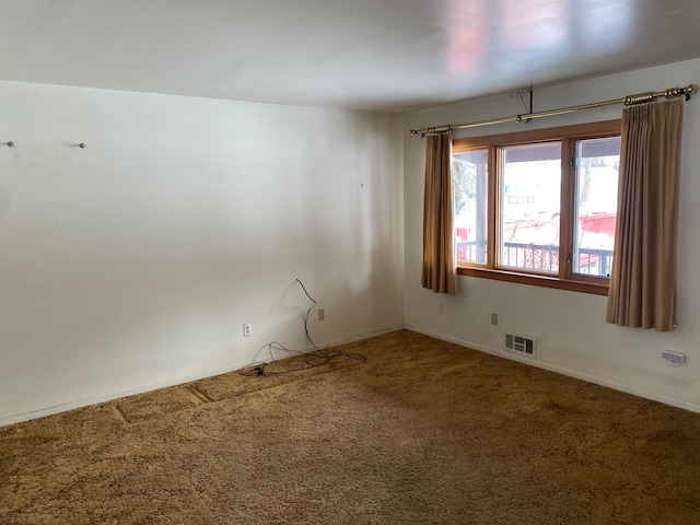 carpeted empty room with visible vents