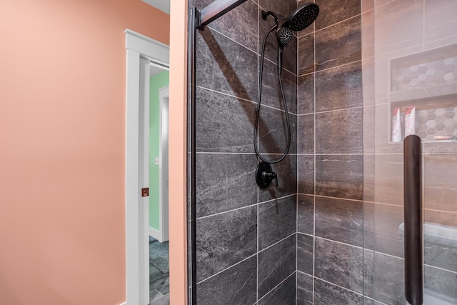 bathroom with tiled shower