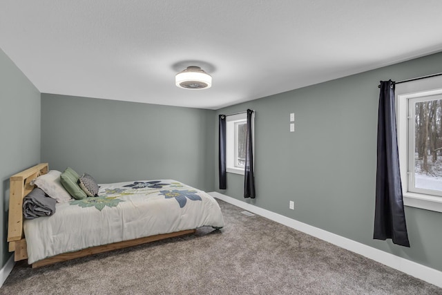 bedroom with carpet and baseboards