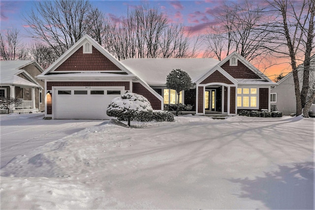 craftsman-style home with driveway and an attached garage