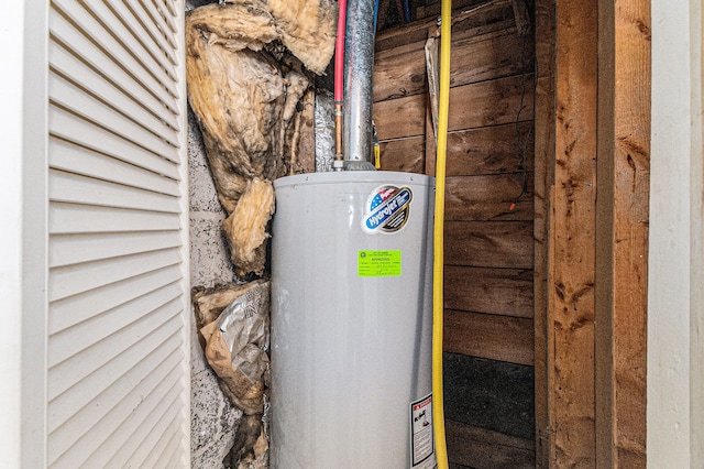 utility room featuring gas water heater