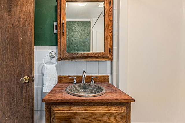 bathroom featuring tile walls and vanity