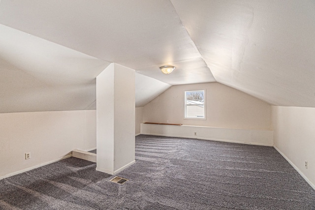 bonus room with carpet flooring, vaulted ceiling, visible vents, and baseboards