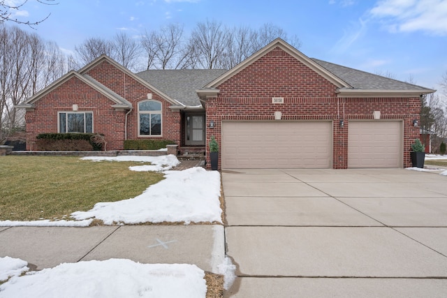 ranch-style house featuring a garage, a shingled roof, concrete driveway, and brick siding