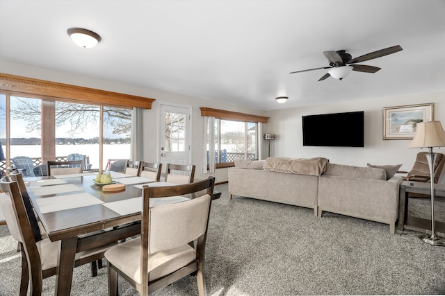 8860 Rushside Dr, Pinckney, MI 48169 - dining area featuring a ceiling fan and carpet floors