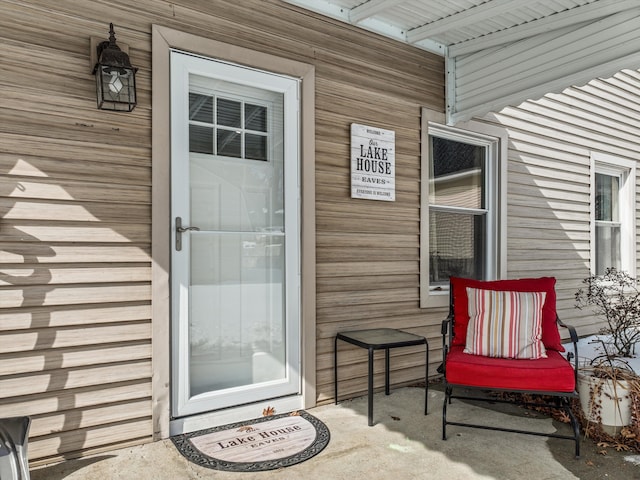 8860 Rushside Dr, Pinckney, MI 48169 - doorway to property with a porch