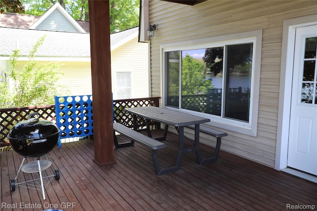 8860 Rushside Dr, Pinckney, MI 48169 - wooden terrace featuring outdoor dining space