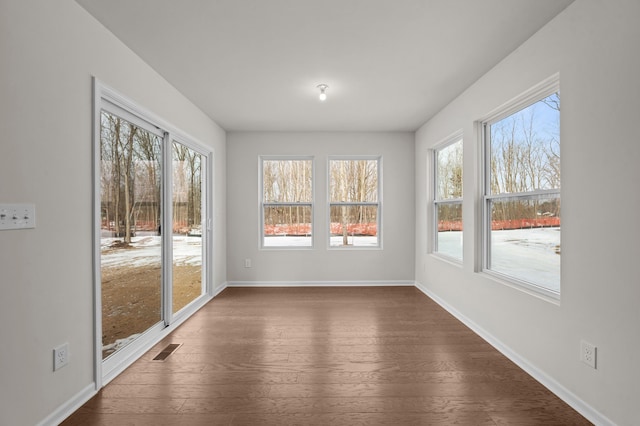 unfurnished sunroom with visible vents