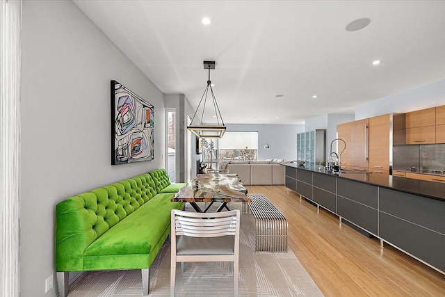 living room featuring light wood finished floors and recessed lighting